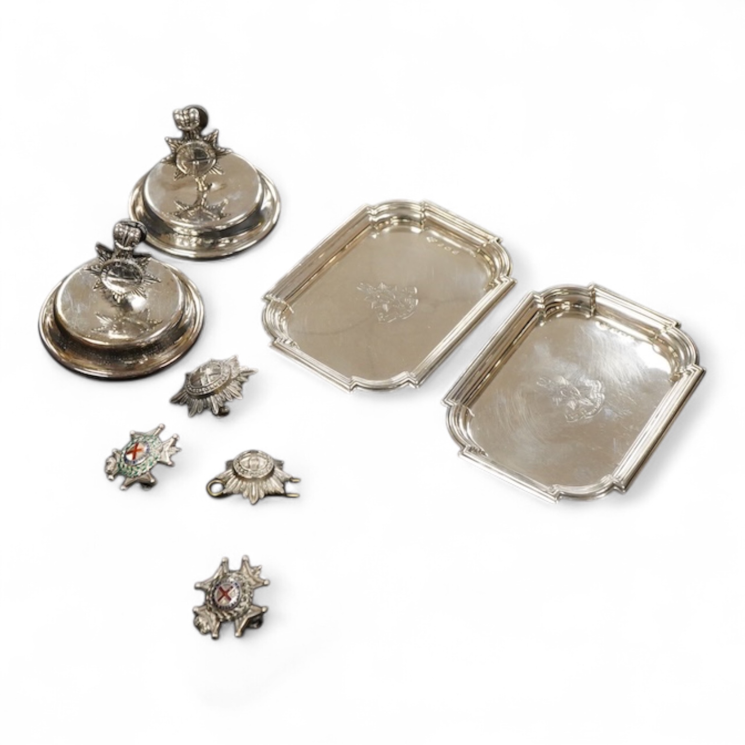 A pair of late Victorian Regimental silver menu holders (Royal Sussex Regiment), a pair of ashtrays and two pairs of uniform pips first height 5cm., weight approx. 7.83ozt